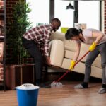 Multiracial couple doing spring cleaning